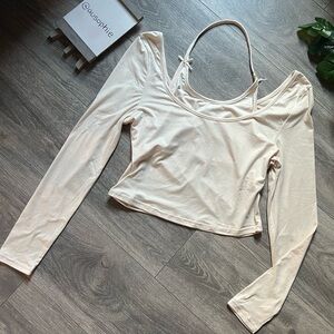 Indero long sleeve crop top with attached faux halter top in cream. Size L NWT!